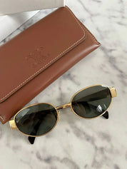 Todelle | Chic Oval Frame Sunglasses | Gold & Black | Durable Metal & Polycarbonate | Your Fashionable Shield Against the Sun